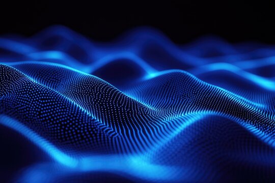 Futuristic digital landscape of glowing blue particles forming undulating waves on a dark background.