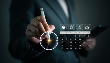 Hand holding digital pen and smartphone interacting with virtual clock and calendar interface. Concept for time management, task planning, project scheduling, productivity and smart work organization.