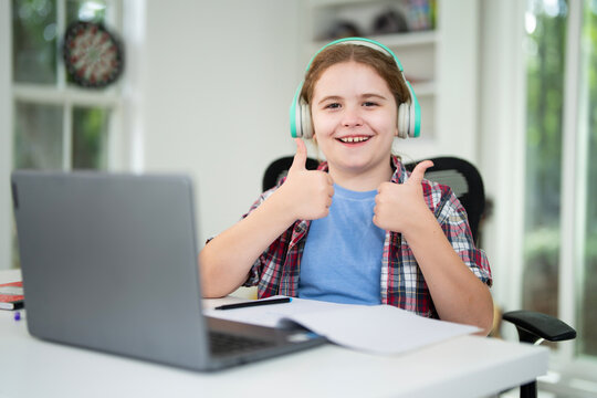 Back to school. Child with laptop at school classroom. Student sitting at desk during distance school class. Smart child study in virtual school. - Powered by Adobe