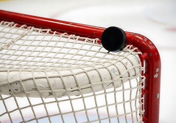 Hockey Puck on Net A Close-Up of Ice Hockey Action