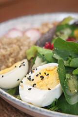 Delicious salad with boiled eggs and fresh vegetables