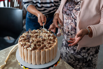 Woman seen cutting the cake