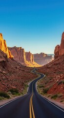 A winding road through a vibrant canyon, bathed in the warm light of the sunrise, showcasing the natural beauty of the landscape.