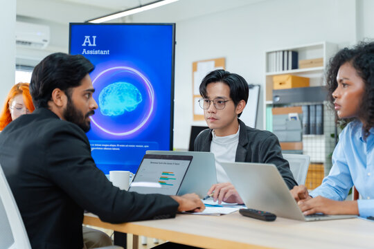 Diverse creative team use Ai Assistant (artificial intelligence assistant) on AI-assisted display for Marketing Data Analyst meeting at office.Coding team,develop Ai Assistant,business brainstorming