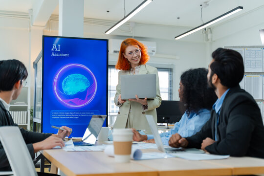 Diverse creative team use Ai Assistant (artificial intelligence assistant) on AI-assisted display for Marketing Data Analyst meeting at office.Coding team,develop Ai Assistant,business brainstorming