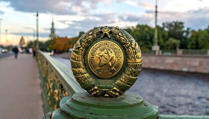 Ornate metal emblem atop bridge railing