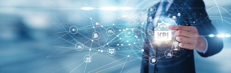 Key Performance Indicator manager holding metrics board Key Performance Indicator icons are...