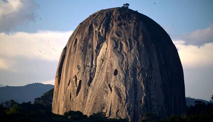 Massive rock formation, dramatic light