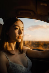 Fototapeta premium young woman in car