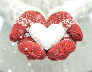 Hands holding a heart in winter