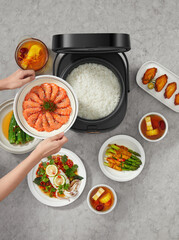 Delicious Asian Cuisine Served with Perfectly Cooked Rice from Modern Electric Rice Cooker