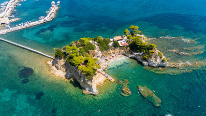 Aerial drone view of Cameo Island Zakynthos Greece with emerald shallow waters rocky cliffs and...