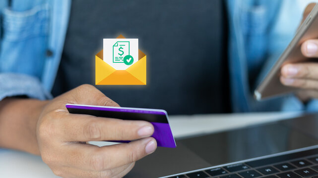 A man using a credit card and smartphone for online bill payment, digital banking, e-billing, secure mobile finance transaction, fintech technology, and electronic payment solution.