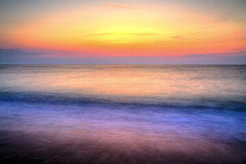 Beautiful summer sunrise over the beach