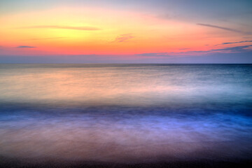 Beautiful summer sunrise over the beach