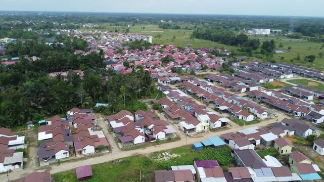 Aerial view of a residential area, some of which is still under construction, surrounded by agricultural areas
