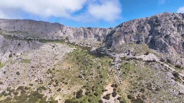 Aerial curls across the powerful mountainous landscape of Pico Chamizo Malaga