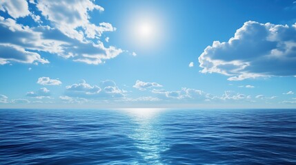 Obraz premium Vast expanse of blue ocean under bright sun with white clouds reflecting calm clear sea sunlight rays evoking tranquility freedom endless horizon.