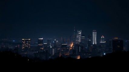 Obraz premium A city skyline illuminated at night with long exposure and deep blue tones. 