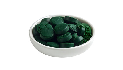 Small white bowl filled with numerous dark-green, compressed, circular tablets