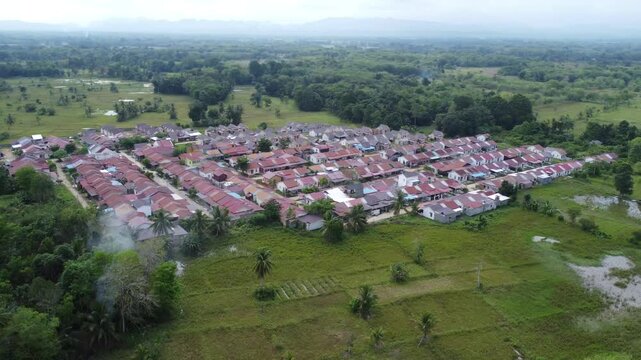 Aerial view of a residential area, some of which is still under construction, surrounded by agricultural areas
