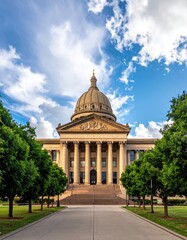 State capitol building, classic design, under a partly cloudy sky