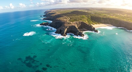 Aerial view of a rugged coastline with turquoise waters and rocky cliffs