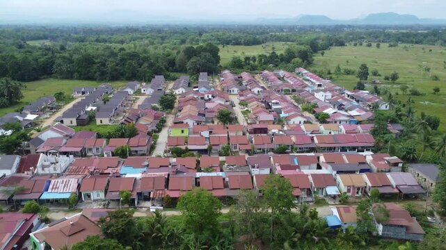 Aerial view of a residential area, some of which is still under construction, surrounded by agricultural areas