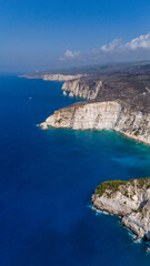 Plakaki beach Zakynthos Greece aerial view of dramatic white cliffs turquoise Ionian Sea deep blue horizon and rugged coastline stretching afar
