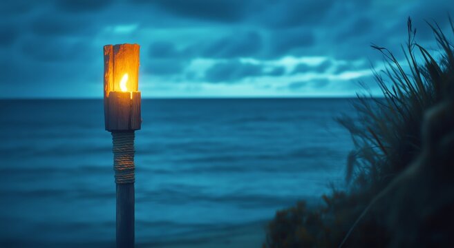 Tiki Torch Burning at Sunset on a Serene Beach With Gentle Waves. - Powered by Adobe