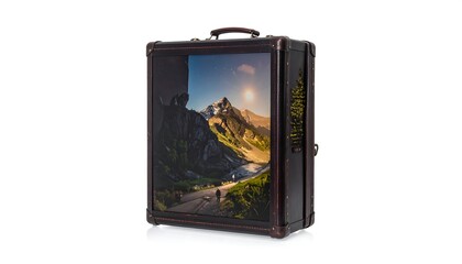 Vintage-style suitcase with mountain scene