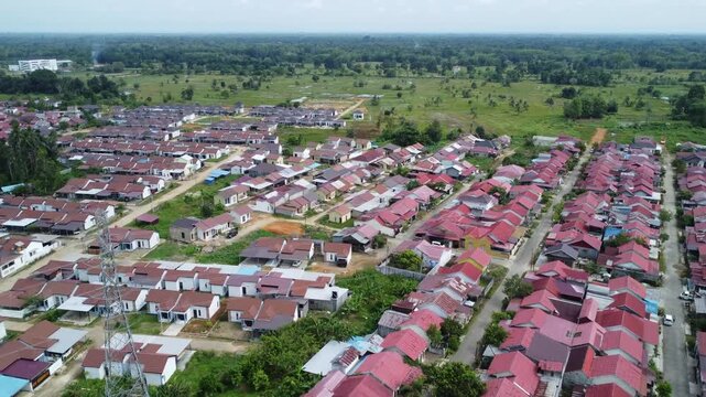 Aerial view of a residential area, some of which is still under construction, surrounded by agricultural areas