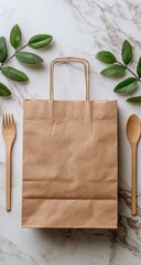 Beige paper bag,  eco-friendly,  with handles,  and  wooden utensils,  surrounded by greenery on marble