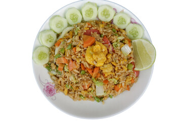 Flavorful vegetarian fried rice with egg beautifully garnished with crisp cucumber and zesty lime. delightful, satisfying meal perfect for wholesome and tasty dining experience