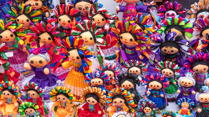 A large assortment of dolls, each with their own unique outfit and accessories. Historic center of...