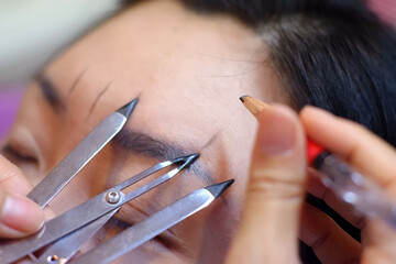 Eyebrow scale measurement before tattooing.