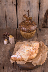 Almond croissant on a wooden background