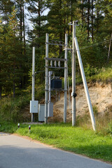 Fototapeta premium Utility pole installation often occurs amidst natures beauty, enhancing communication