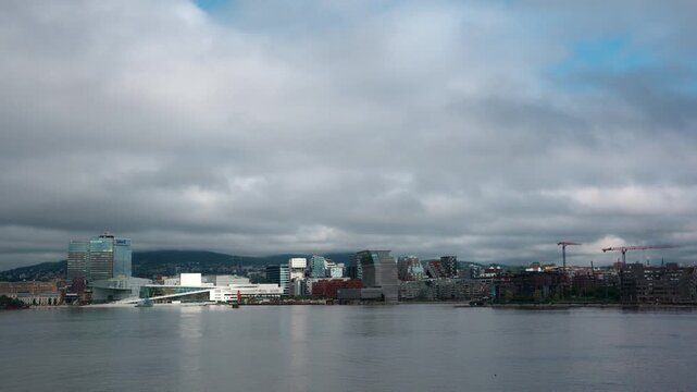 Scenic time lapse of downtown Oslo, Norway on a sunny day with the clouds moving