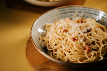 Enjoying traditional pasta bolognese served in a cozy dining setting