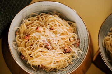 Enjoying a delicious bowl of pasta bolognese in a cozy kitchen setting