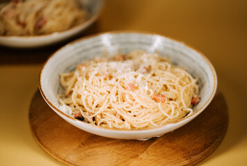 Delicious pasta bolognese served on a wooden table in a cozy kitchen setting