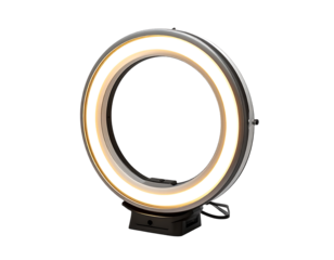 A circular LED ring light with a warm white glow, mounted on a small, dark grey base with a visible power cord