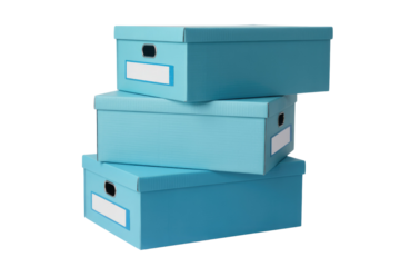 Three light blue cardboard storage boxes stacked neatly, featuring label slots and metallic handles. background removed