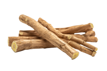 A close-up shot of several licorice roots, showing their texture and pale yellow interior. background removed
