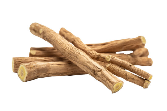 A close-up shot of several licorice roots, showing their texture and pale yellow interior. background removed