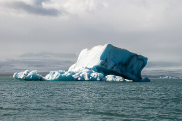 Jokulsarlon Iceland, large square iceberg drifting in glacier lagoon