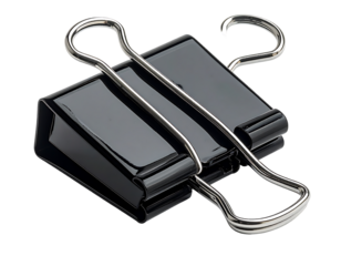A large, black, metallic binder clip with shiny silver wire arms, angled slightly to the right, isolated on a black background