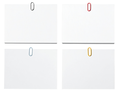 Four blank, white rectangular pieces of paper, each secured by a different-colored paperclip