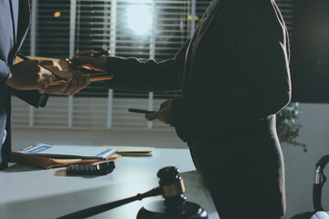 Lawyer explained to the client about the law that must be brought against the court case.